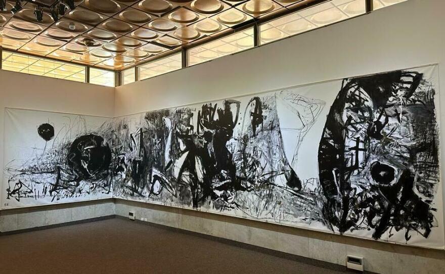 A painting by a Ukrainian artist depicts the war at an exhibition at Ukrainian House, a cultural center in Kyiv. The exhibit features works produced since the full-scale Russian invasion last year, and is part of a larger effort to encourage Ukrainians to discuss mental health issues.