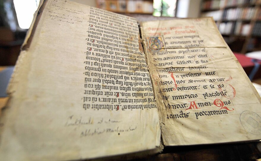 Pages of the Gutenberg Bible in Colmar, France. Religious historian Philip Jenkins says scriptures from the Bible are more violent than those from the Quran.