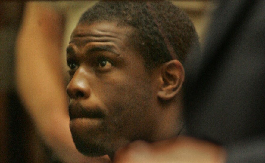 Lawrence Phillips, seen here in a 2005 photo, has been charged with murder while serving a prison sentence for assault and other charges.