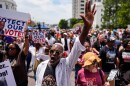 A man sings a spirtual song during a voting rally, Saturday, May 16, 2026, in Montgomery, Ala.