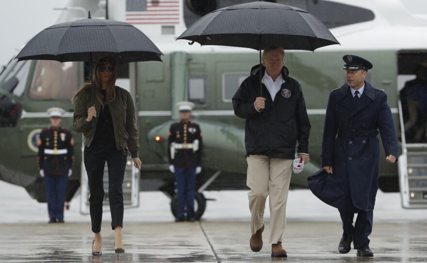 President Trump and first lady Melania Trump walk Tuesday from Marine One to board Air Force One at Andrews Air Force Base for a trip to Texas to get an update on Hurricane Harvey relief efforts.
