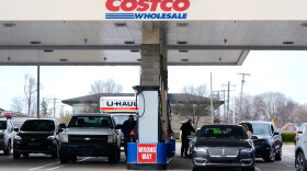 Drivers fuel up at a Costco gas station in Roseville, Mich.