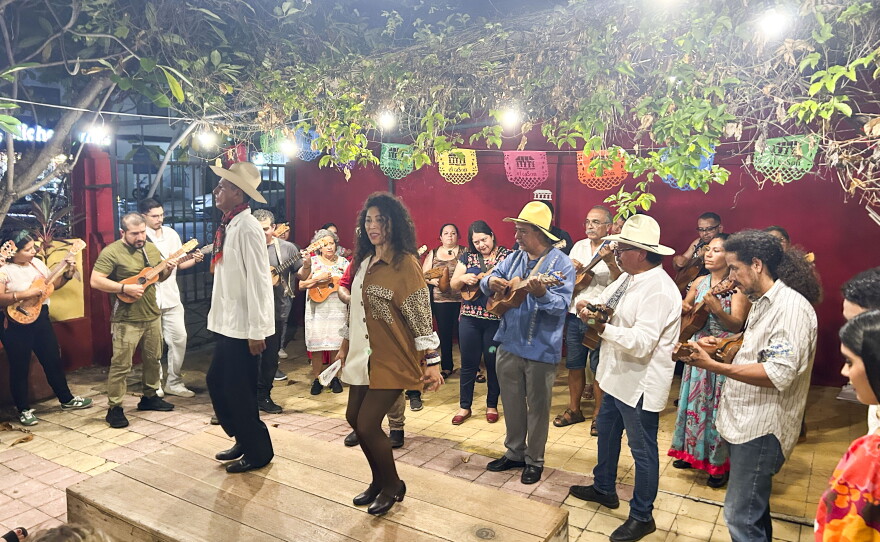 Jarana players join a mass jam session at a Veracruz fandango while the dancers pound out rhythms with their heels on the wooden tarima. 