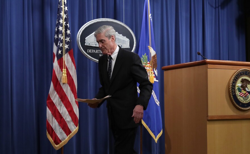 Special counsel Robert Mueller leaves after making a statement about the Russia investigation on Wednesday at the Justice Department. After the investigation, he said, "if we had had confidence that the president clearly did not commit a crime we would have said so."