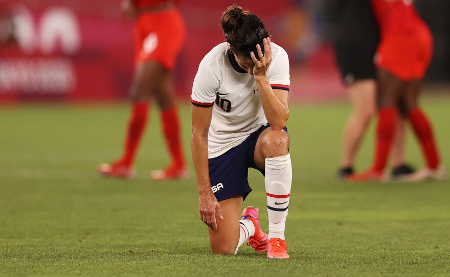 Carli Lloyd the U.S. women's soccer team looks dejected after their defeat in Monday's semifinal match against Canada in the Tokyo Olympics.