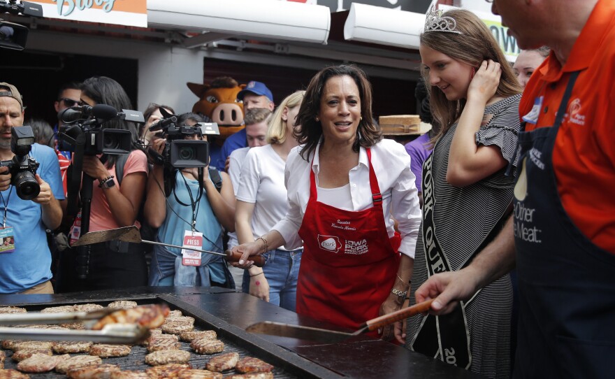 Democratic presidential candidate Kamala Harris flips pork chops at the Iowa State Fair on Saturday. She came to the fair intent on proving she's a top-tier contender.