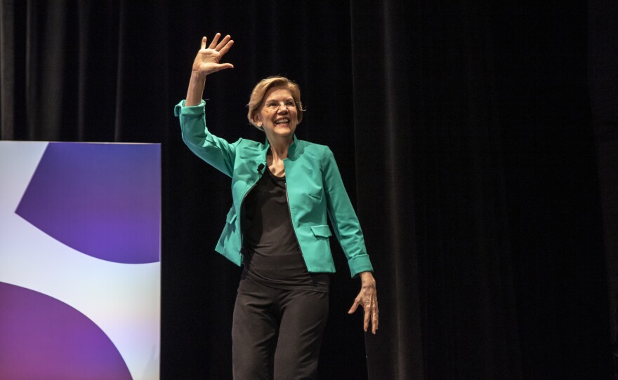 Democratic presidential candidate Sen. Elizabeth Warren of Massachusetts waves to a crowd at the She The People Presidential Forum in Houston.