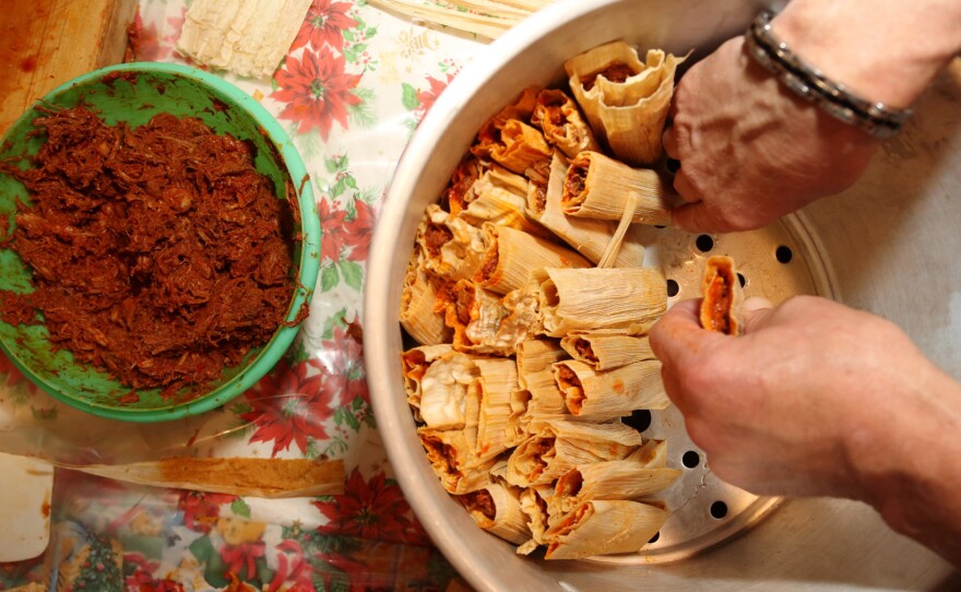 Pork tamales are assembled before steaming. Tamale-making is labor intensive, one reason why the bundles of masa tend to be reserved for special occasions.