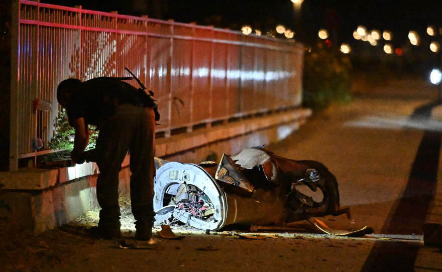 Israeli security forces examine a fragment of an intercepted Iranian missile in northern Israel, early Monday, June 8, 2026.