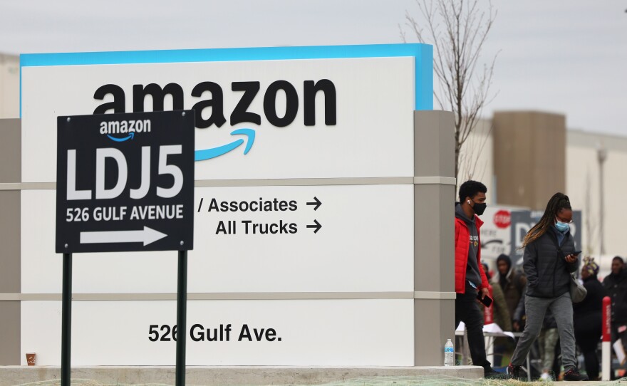 Workers walk toward an Amazon warehouse on Staten Island, New York, on April 25, 2022. It's the second Amazon facility on Staten Island to vote on whether to join the Amazon Labor Union.