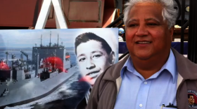 Paul Chavez stands in front of a picture of his father, Cesar. The newest cargo ship being built at NAASCO will be named the USNS Cesar Chavez after the late civil rights leader.