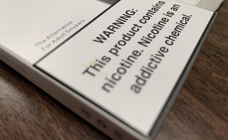 A warning about nicotine on the package of mango-flavored nicotine pods from Juul, Sept. 17, 2019.