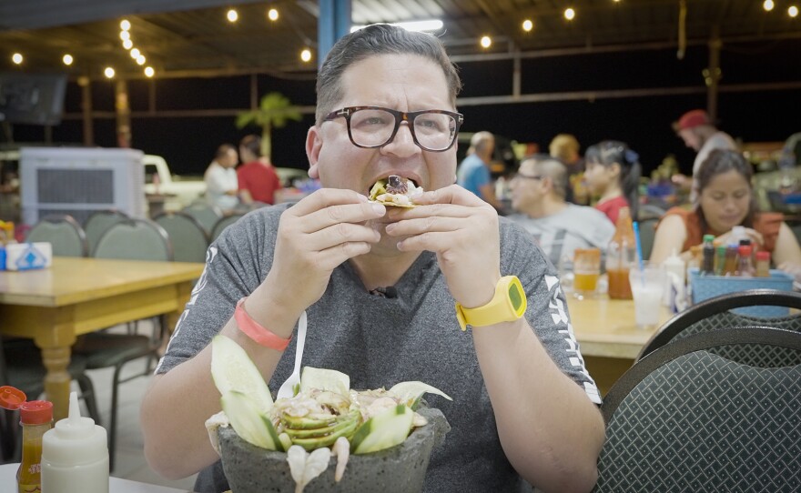 Host Jorge tries some of the treats at the Caguamas Seafood restaurant on the main San Felipe boulevard, Mexico.