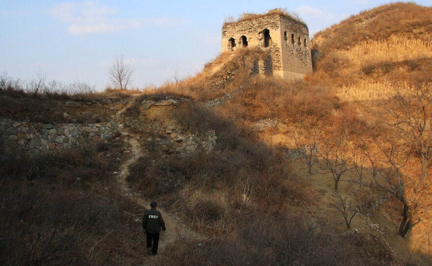 Qiao Guohua patrols a 5-mile stretch of the Great Wall of China. Roughly a third of the wall's 12,000 miles have crumbled to dust, and saving what's left may be the world's greatest challenge in cultural preservation.