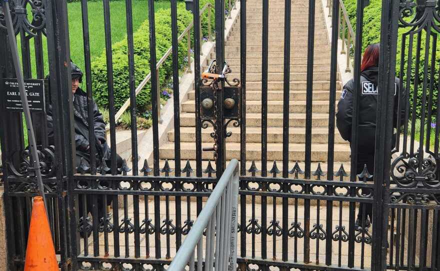 A gate that has been a main access point into Columbia University's Morningside campus was locked Tuesday morning, as the school restricted access to only those students who live on the campus, and essential workers.