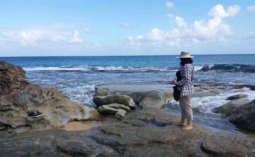 Isabel Rivera-Collazo is pictured in Manati, Puerto Rico. She was studying petroglyphs that had been exposed by coastal erosion after a storm event.