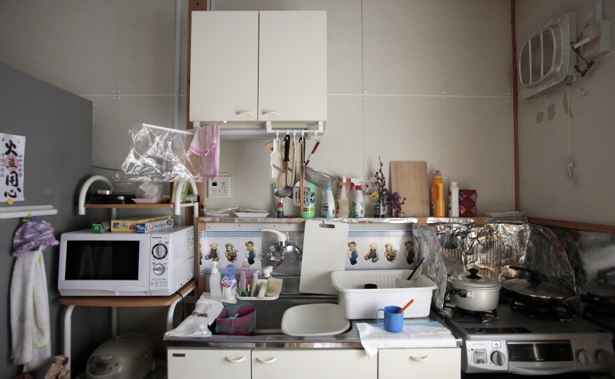 The kitchen of one of the temporary homes. Often, the evacuees find themselves living in much smaller spaces than they used to occupy.