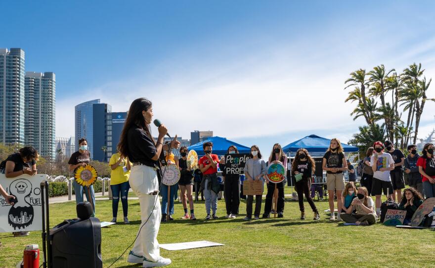 Youth climate activist Keala Minna-Choe speaks to other students about the need for collective action for climate, at a climate strike in San Diego, March 25, 2022.