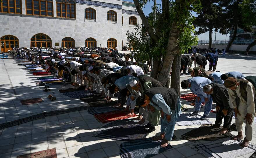 Muslim worshipers in Kabul offer prayers Sunday at the start of Eid al-Fitr, which marks the end of the Muslim holy month of Ramadan. The Taliban announced a three-day ceasefire during the holiday, a surprising move after months of bloody fighting.