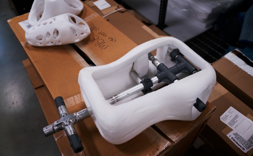 An earlier version of the mannequin that holds the suit in place. The mannequin is built to preserve the suit's internal rubber and plastic parts. It gives structural support and also pipes fresh air to protect against buildup of harmful vapors.