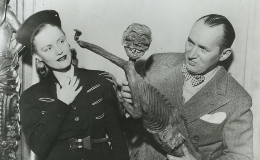 Robert Ripley with the Feejee Island Mermaid which he exposed as a fraud; half monkey half fish, cleverly sewn together by a taxidermist. (1939)