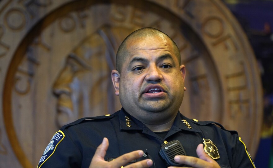 Interim Seattle Police Chief Adrian Diaz addresses a news conference about changes being made at the department, earlier this month. The SPD announced Thursday that an officer seen on video rolling his bicycle over a downed protester will be suspended pending an investigation.