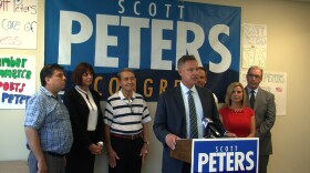Congressman Scott Peters speaks at a news conference at his campaign office, Sept. 3, 2014.
