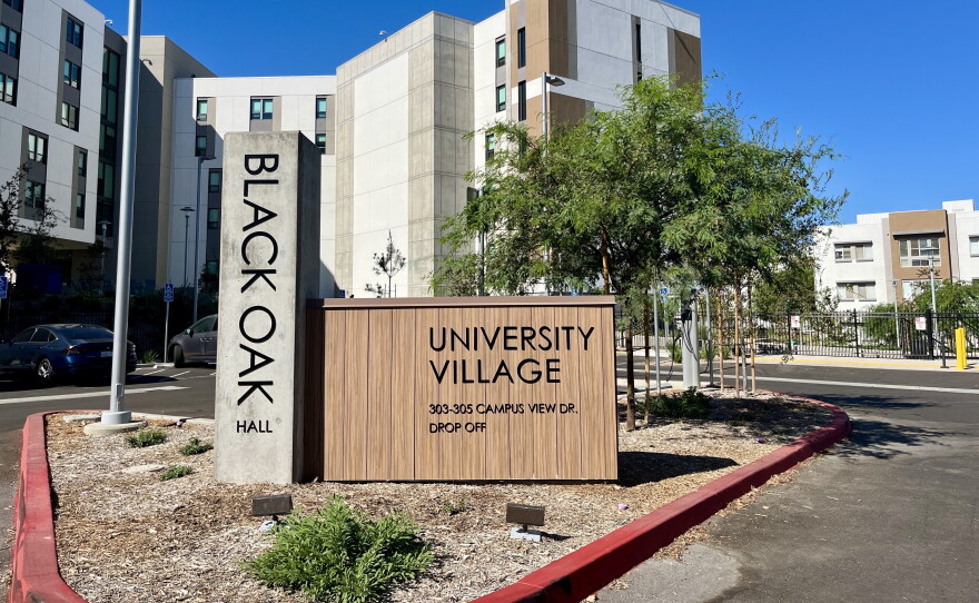 A sign for the newly-opened Black Oak Hall student housing stands out from of the residence, Oct. 9, 2026.
