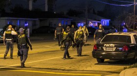 Authorities guard the perimeter near the location of an officer-involved shooting in San Bernardino, Dec. 2, 2015.
