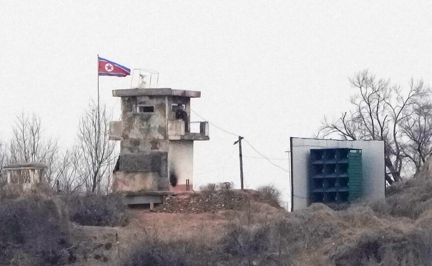 FILE - A soldier stands at a North Korean military guard post next to loudspeakers, seen from Paju, South Korea, near the border with North Korea, on Feb. 26, 2026.