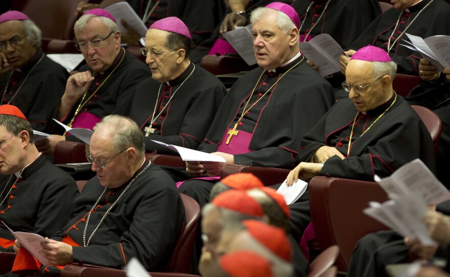 Bishops, wearing purple skull caps, are shown on Thursday at the Vatican. They were elevated to cardinals in a ceremony Saturday.