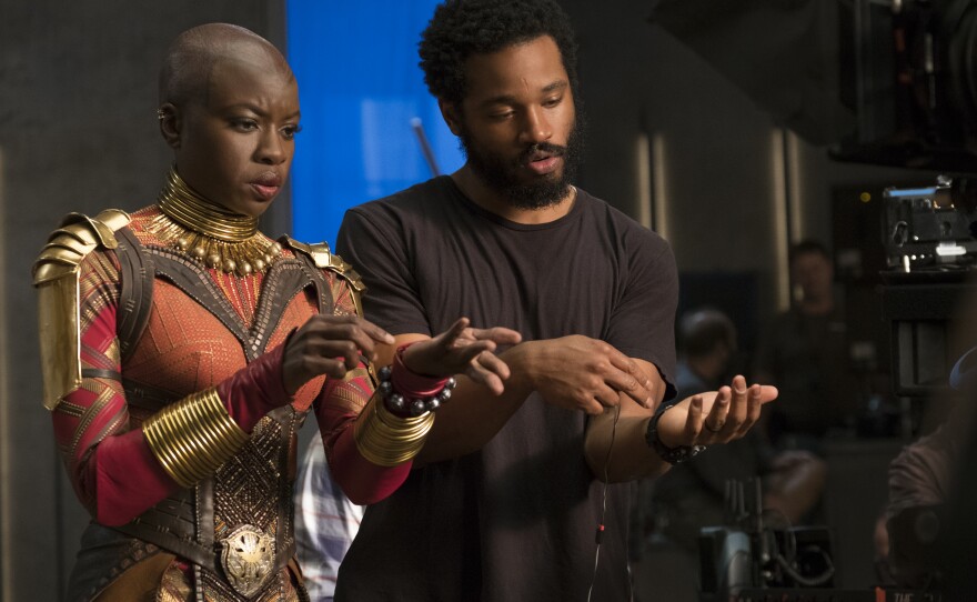 Actress Danai Gurira takes direction from Ryan Coogler on the set of "Black Panther."