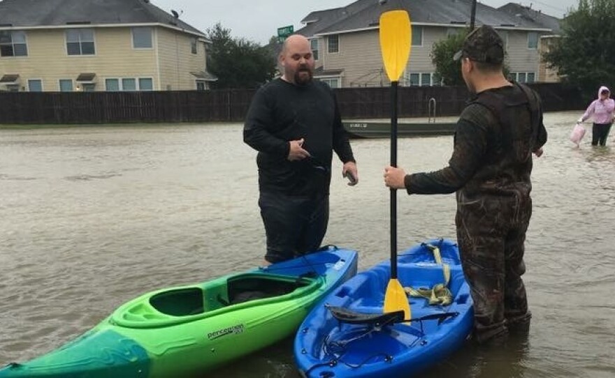 Brandon McElveen (left) is a school counselor at the KIPP Explore Academy elementary school in Houston.