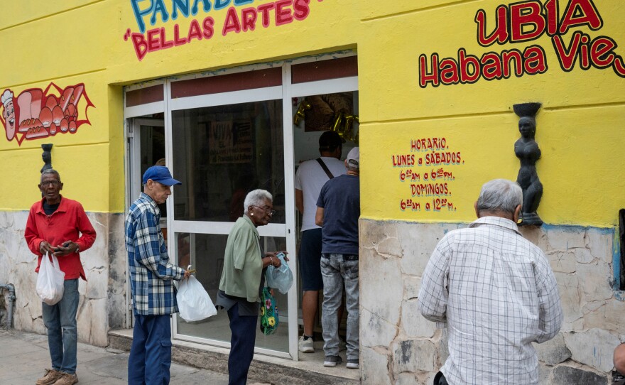 Older people line up to buy bread at a bakery in Havana on March 8.