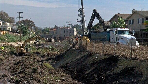 Crews are shown cleaning mud out of the Chollas Creek in Southcrest on Jan. 31, 2024.
