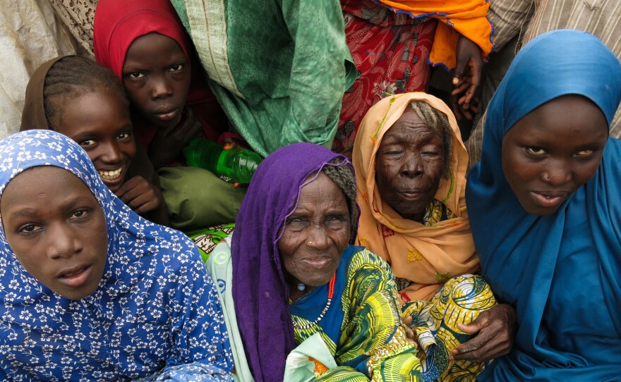 Displaced women at the Muna informal settlement outside Maiduguri. They're among more than 2 million people driven from their homes by Boko Haram attacks during northeastern Nigeria's 7-year insurgency.