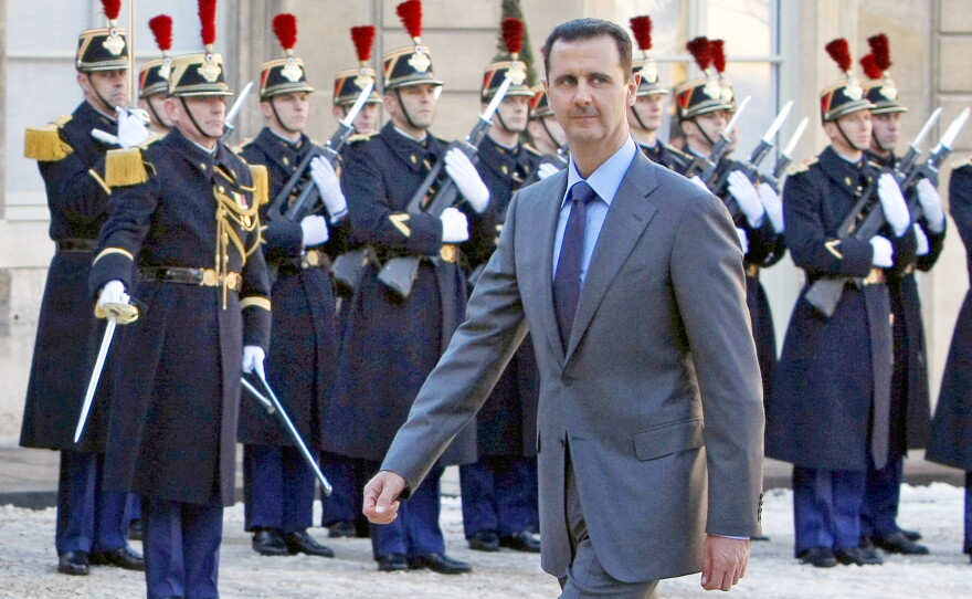 FILE - In this Dec. 9, 2010 file photo, Syria President Bashar al-Assad arrives at the Elysee Palace in Paris for his meeting with French President Nicolas Sarkozy.
