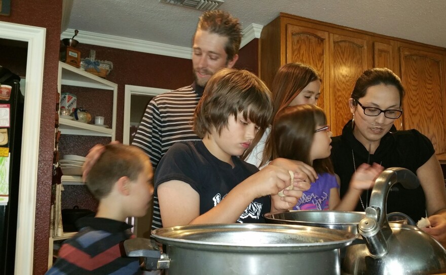 Stephanie and Brian Packer make lunch with their children, Brian, 11, Savannah, 5, Scarlett, 10, and Jacob, 8.