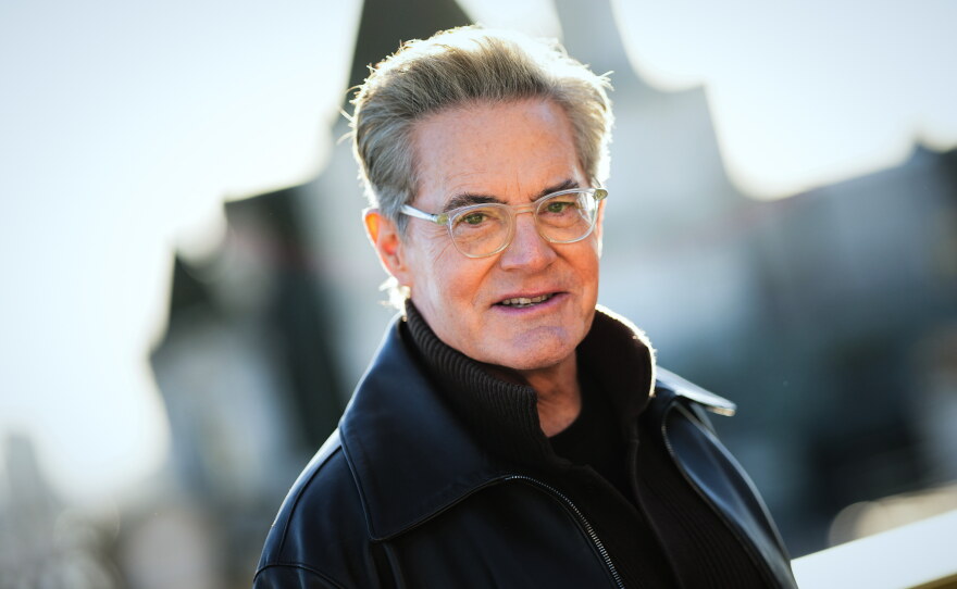 "Ultimately, I was the audience's guide into a very scary place," Kyle MacLachlan says of his roles in Blue Velvet and Twin Peaks. He's shown above in London on Dec. 3, 2025.