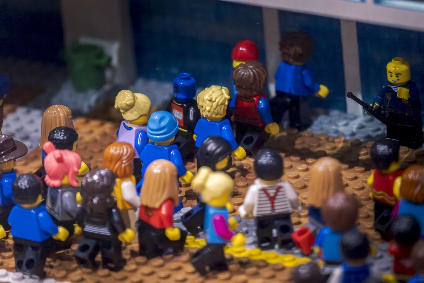LEGO people pass through the LEGO Comic-Con convention doors on July 25, 2025.