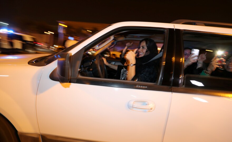 A Saudi woman celebrates with her friends as she drives her car in al-Khobar, Saudi Arabia, on Sunday. The lifting of the ban on women driving marks a milestone for women in the kingdom who have had to rely on drivers, male relatives, taxis and ride-hailing services to get to work, go shopping and simply move around.