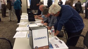Residents write comments for an environmental report on plans to improve Palomar Airport to accommodate larger jets. February 29th 2016