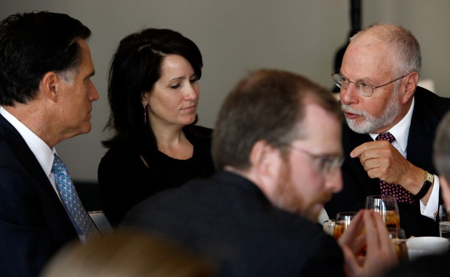 Paul Singer (right) speaks with Mitt Romney during a forum of the Foreign Policy Initiative in Washington in 2009.