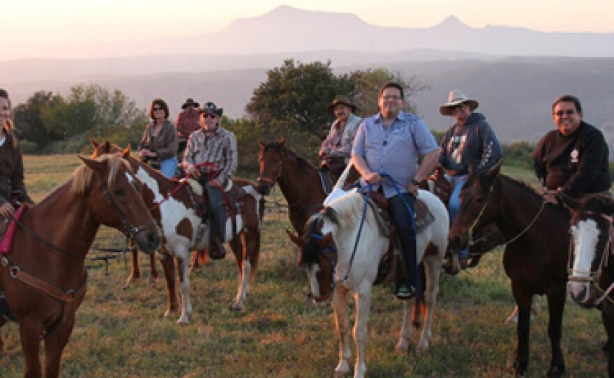 CROSSING SOUTH host Jorge Meraz (center front) rides horseback with friends from All the Pretty Horses of Baja Rescue just south of Rosarito, in Baja California, Mexico.