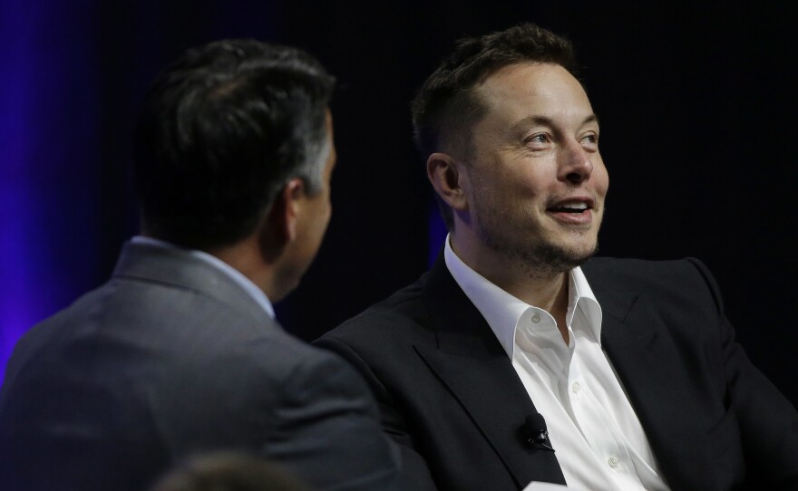 Artificial intelligence poses an existential risk to human civilization, Elon Musk (right) told the National Governors Association meeting Saturday in Providence, R.I.