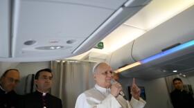 Pope Leo XIV speaks to journalists aboard his flight bound for Algiers' Houari Boumédiène International Airport on Monday, April 13, 2026, at the start of an 11-day apostolic journey to Africa.