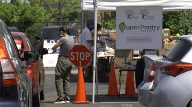 Cars lined up for a food pantry at Jewish Family Service in Kearny Mesa, June 25, 2020.