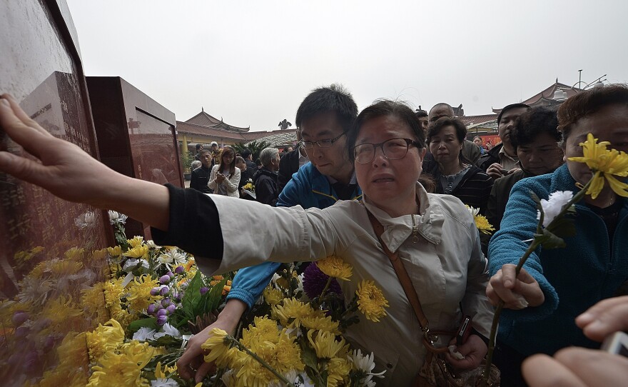 Relatives of deceased organ donors mourn for them at a ceremony unveiling a monument for the organ donors in April in Chongqing, China.
