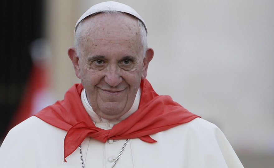 Pope Francis leaves St. Peter's Square at the Vatican in August. In a letter published Tuesday, he said, in part, "I have decided ... to concede to all priests for the Jubilee Year the discretion to absolve of the sin of abortion those who have procured it and who, with contrite heart, seek forgiveness for it."