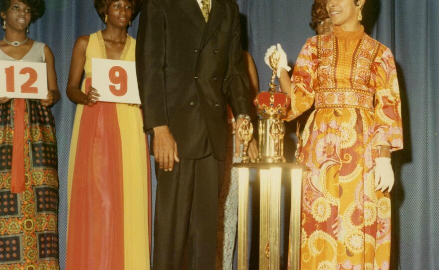 Dr. Nathaniel Bronner presenting the 1st place trophy to Xernona Clayton in the 1960s. She was a popular beautician before becoming a renowned civil rights leader and broadcasting executive.